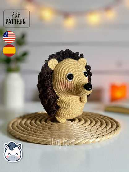 This Hedgehog crochet pattern PDF is a handmade geek amigurumi plush toy inspired by cute woodland animals. This kawaii-style crochet pattern includes a detailed step-by-step photo tutorial to help you create your own adorable spiky hedgehog plush. Perfect for nature lovers, geek collectors, and handmade enthusiasts. Available in English and Spanish as a digital instant download for your next cozy crochet project.