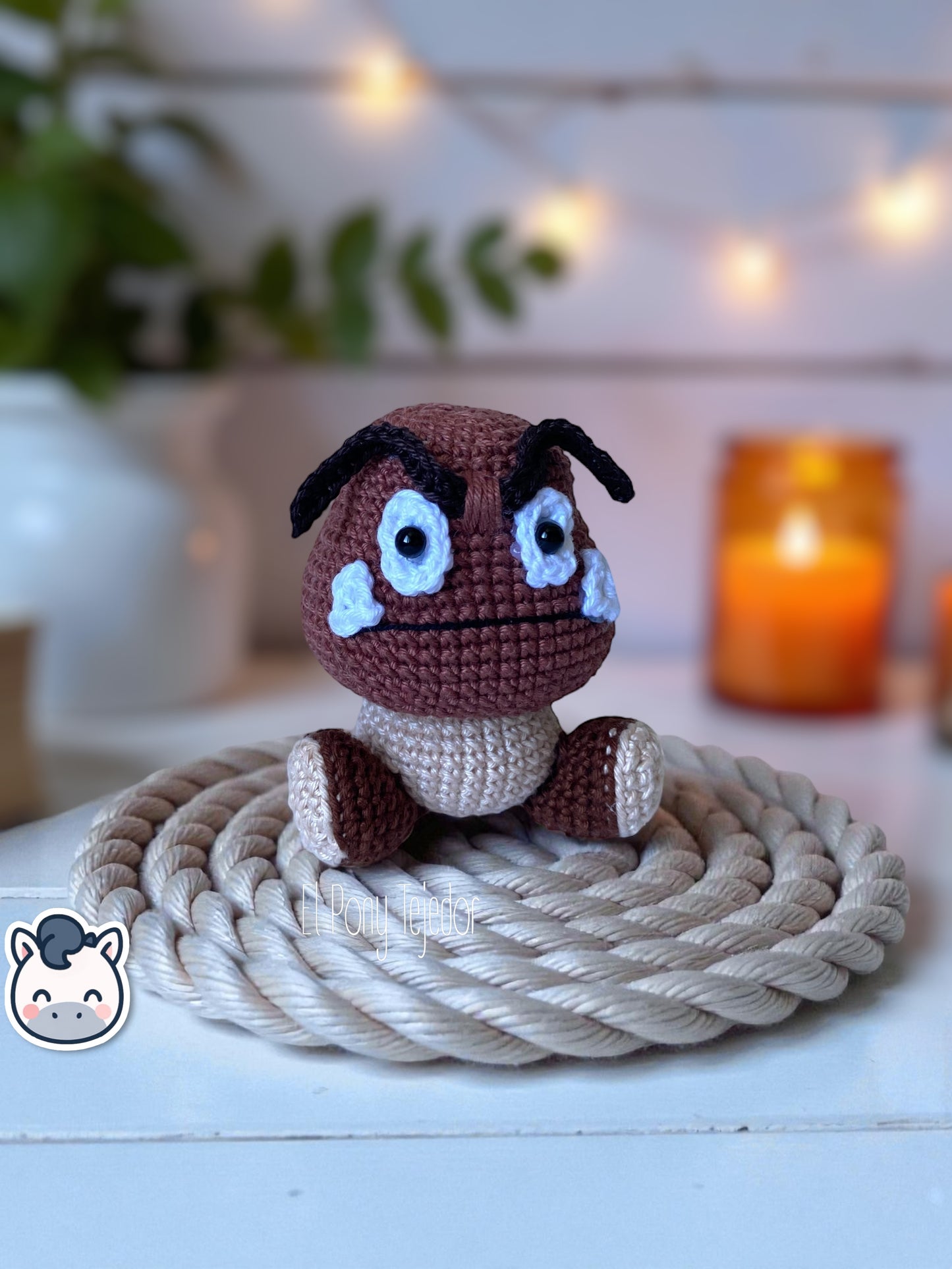 Handmade Goomba amigurumi inspired by Nintendo’s Super Mario Bros, soft crochet plush perfect for Mushroom Kingdom fans and collectors. Artisan plush toy by El Pony Tejedor.