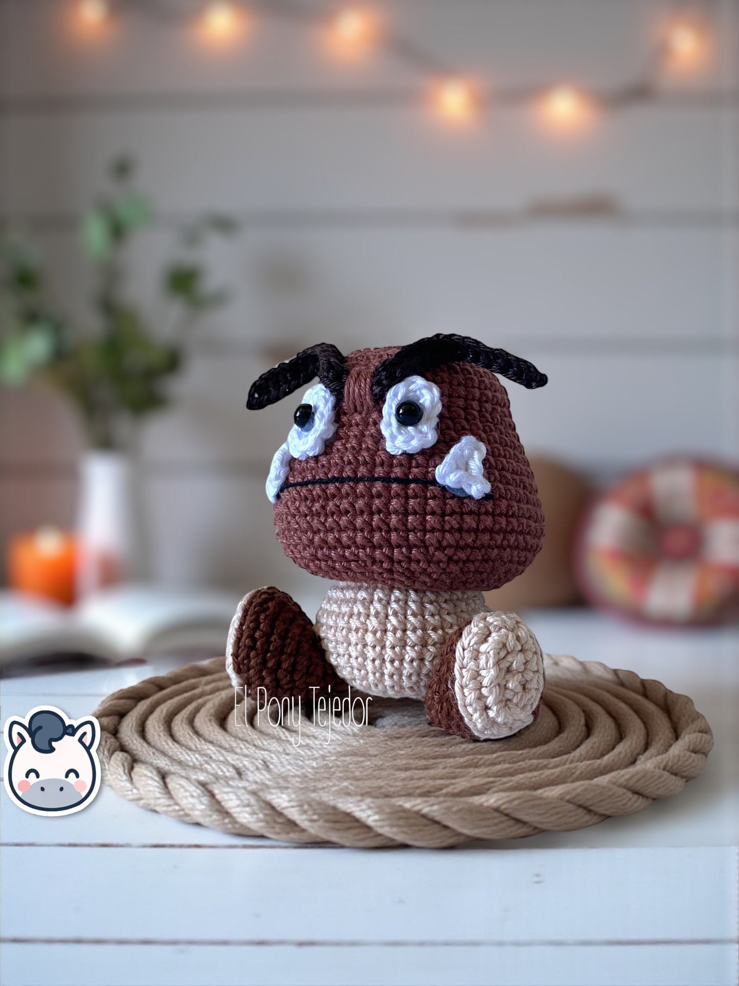 Handmade Goomba amigurumi inspired by Nintendo’s Super Mario Bros, soft crochet plush perfect for Mushroom Kingdom fans and collectors. Artisan plush toy by El Pony Tejedor.