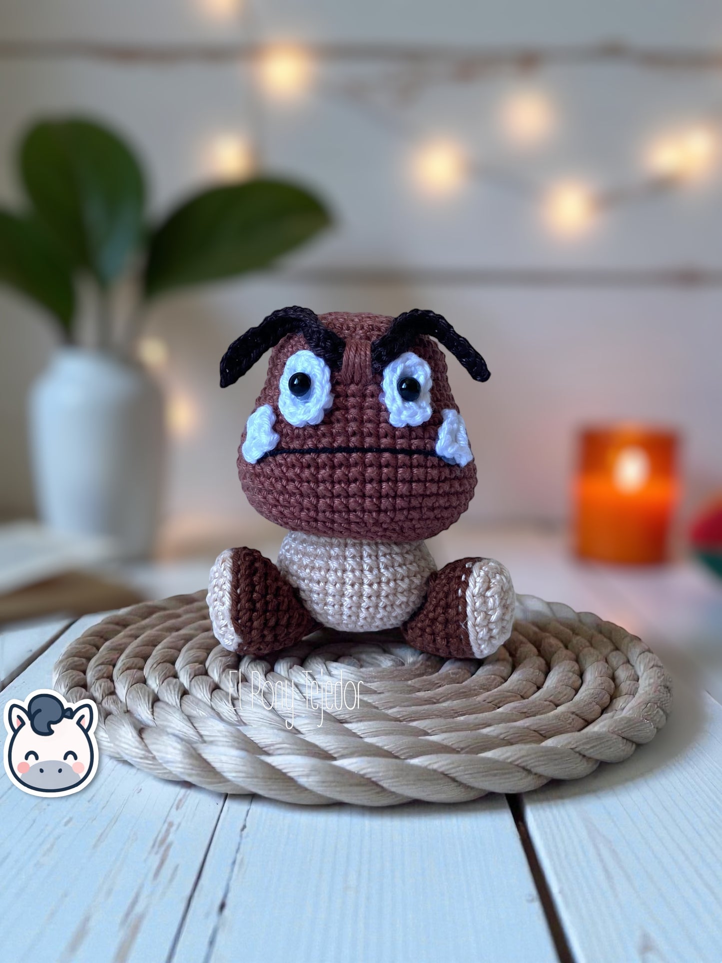Handmade Goomba amigurumi inspired by Nintendo’s Super Mario Bros, soft crochet plush perfect for Mushroom Kingdom fans and collectors. Artisan plush toy by El Pony Tejedor.