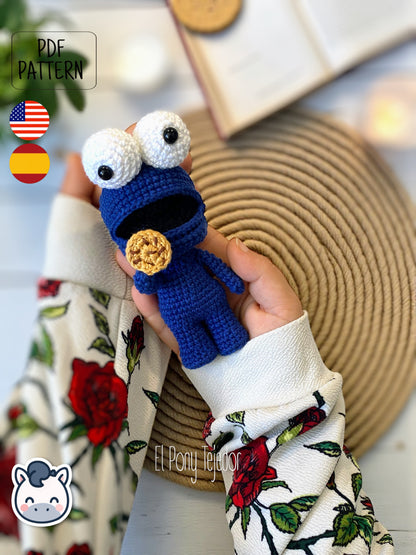 Handmade Cookie Monster amigurumi inspired by Sesame Street, a perfect pattern for fans of cookies, retro TV, and cute geek crochet.