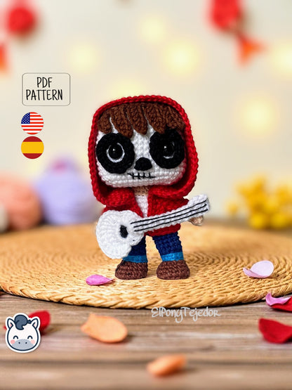 Handmade Miguel amigurumi inspired by Disney and Pixar’s Coco, a perfect pattern for fans of Día de Muertos, Halloween, and musical crochet art.