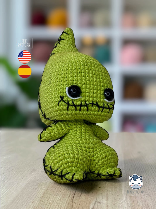 Amigurumi Baby Oogie Boogie inspirado en Pesadilla antes de Navidad, un patrón de crochet adorable y terrorífico perfecto para fans de Disney, Halloween y muñecos estilo geek.