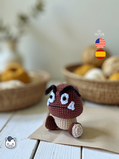 Amigurumi Goomba inspirado en Super Mario Bros, tejido a mano en ganchillo, un patrón PDF perfecto para fans de Nintendo y los videojuegos retro.