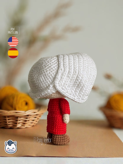 Patrón de ganchillo amigurumi de June del cuento de la criada con vestido rojo y cofia blanca, muñeca tejida a crochet.
