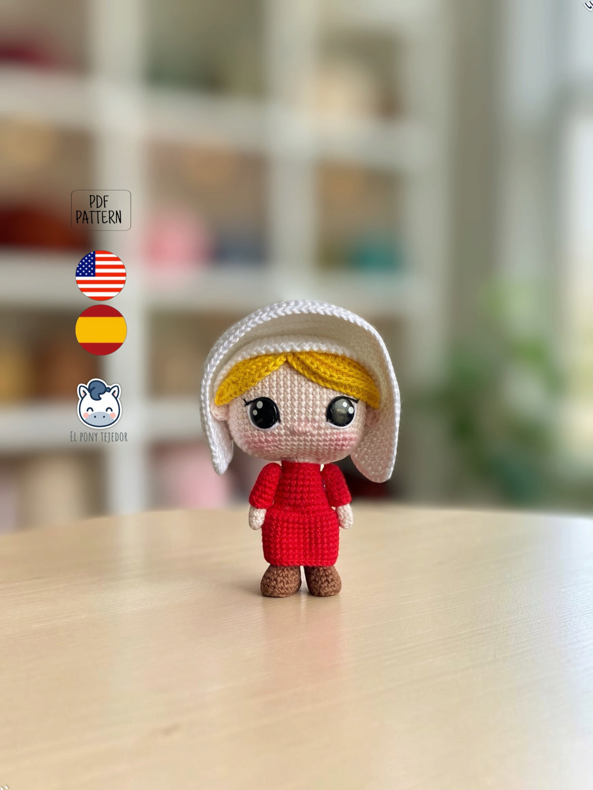 June amigurumi crochet pattern inspired by The Handmaid’s Tale, featuring a doll with a red dress and white bonnet.