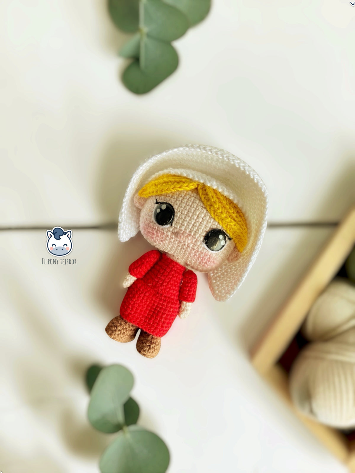 June amigurumi crochet pattern inspired by The Handmaid’s Tale, featuring a doll with a red dress and white bonnet.