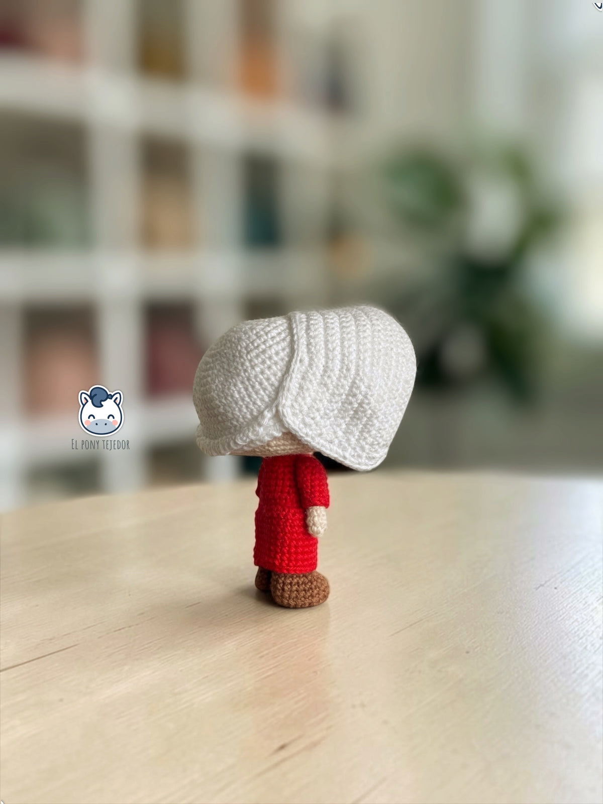 June amigurumi crochet pattern inspired by The Handmaid’s Tale, featuring a doll with a red dress and white bonnet.