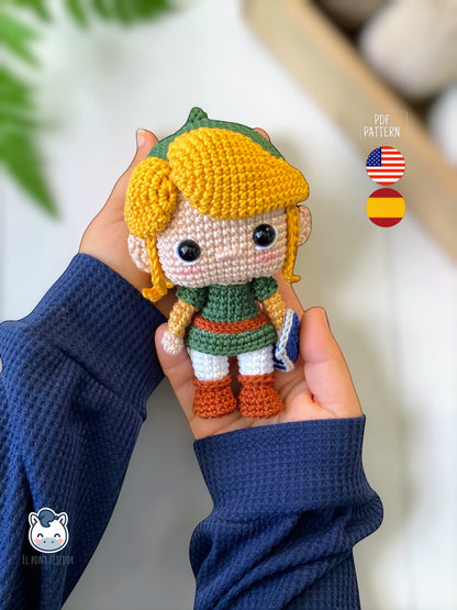 Handmade Link amigurumi inspired by The Legend of Zelda, a geek crochet pattern PDF in Funko style for Nintendo fans. Amigurumi de Link inspirado en The Legend of Zelda, un patrón de ganchillo estilo Funko perfecto para fans de Nintendo y videojuegos.