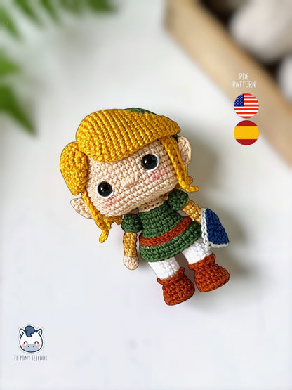 Handmade Link amigurumi inspired by The Legend of Zelda, a geek crochet pattern PDF in Funko style for Nintendo fans. Amigurumi de Link inspirado en The Legend of Zelda, un patrón de ganchillo estilo Funko perfecto para fans de Nintendo y videojuegos.