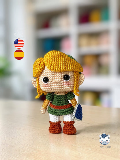 Handmade Link amigurumi inspired by The Legend of Zelda, a geek crochet pattern PDF in Funko style for Nintendo fans. Amigurumi de Link inspirado en The Legend of Zelda, un patrón de ganchillo estilo Funko perfecto para fans de Nintendo y videojuegos.