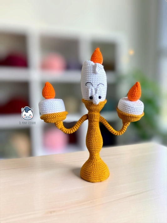 Handmade Lumière amigurumi inspired by Disney’s Beauty and the Beast, featuring three orange candle flames, a detailed crochet design and poseable arms. A magical crochet pattern PDF for Disney fans and amigurumi lovers.