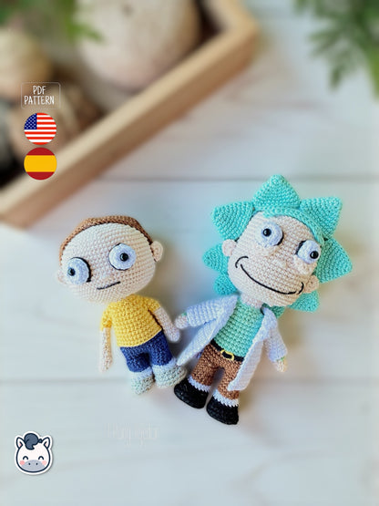 Rick and Morty amigurumi crochet dolls with white lab coat, blue spiky hair and iconic expressions, displayed on a natural background.