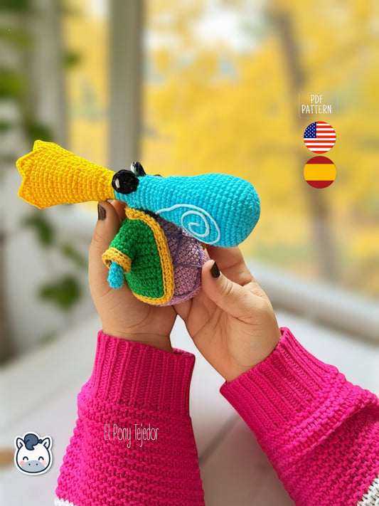 Amigurumi Rayman Diminuto (Teensies) tejido a mano, inspirado en el videojuego Rayman, patrón de crochet mini y colorido para fans gamers y geek.