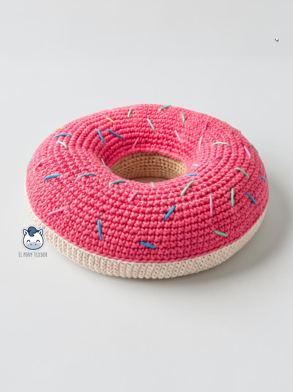 Patrón de juguete para perro en forma de donut a crochet, ideal para galgos, perros grandes y proyectos pet friendly hechos a mano.